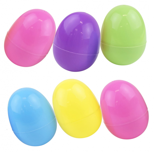 Plastic easter eggs lined up on white background