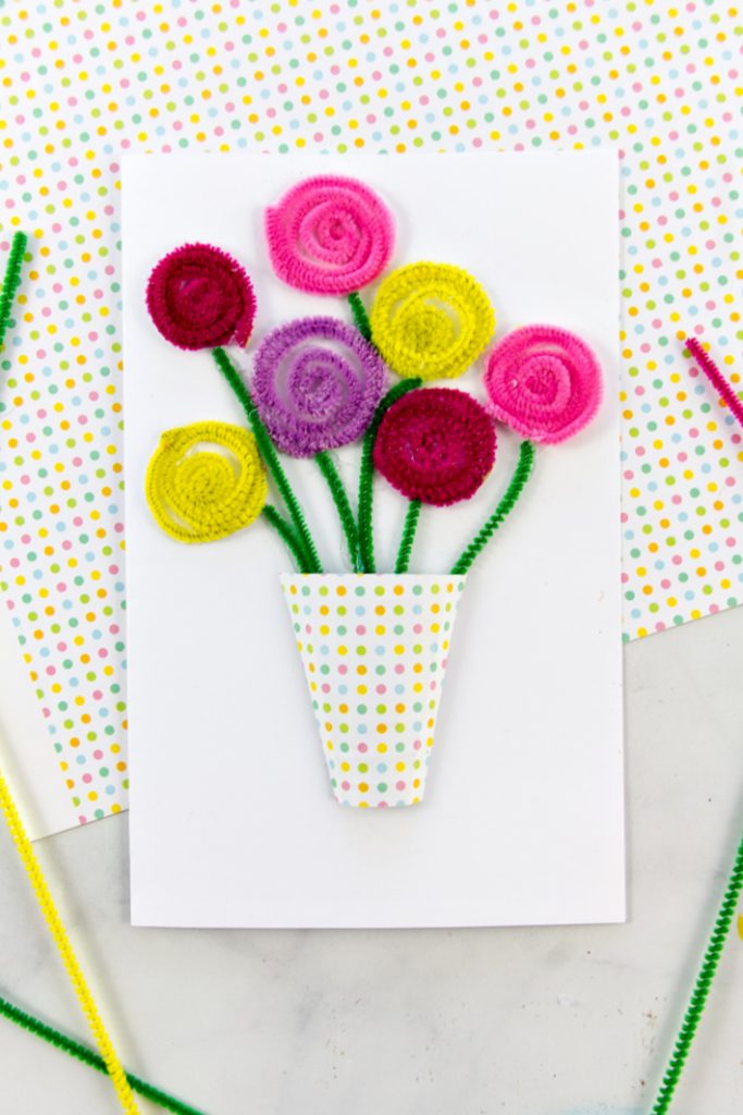 A handmade floral card with the flowers made from colorful pipe cleaners.