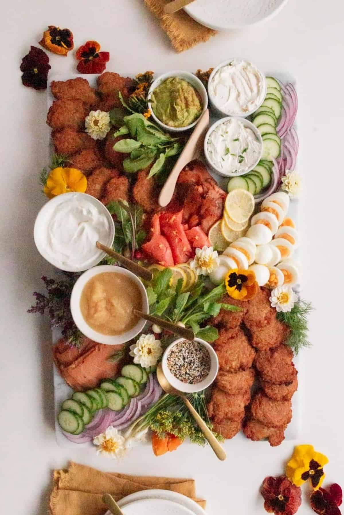 a latke board with hard boiled eggs, dips, veggies and more from Amanda Wilen.