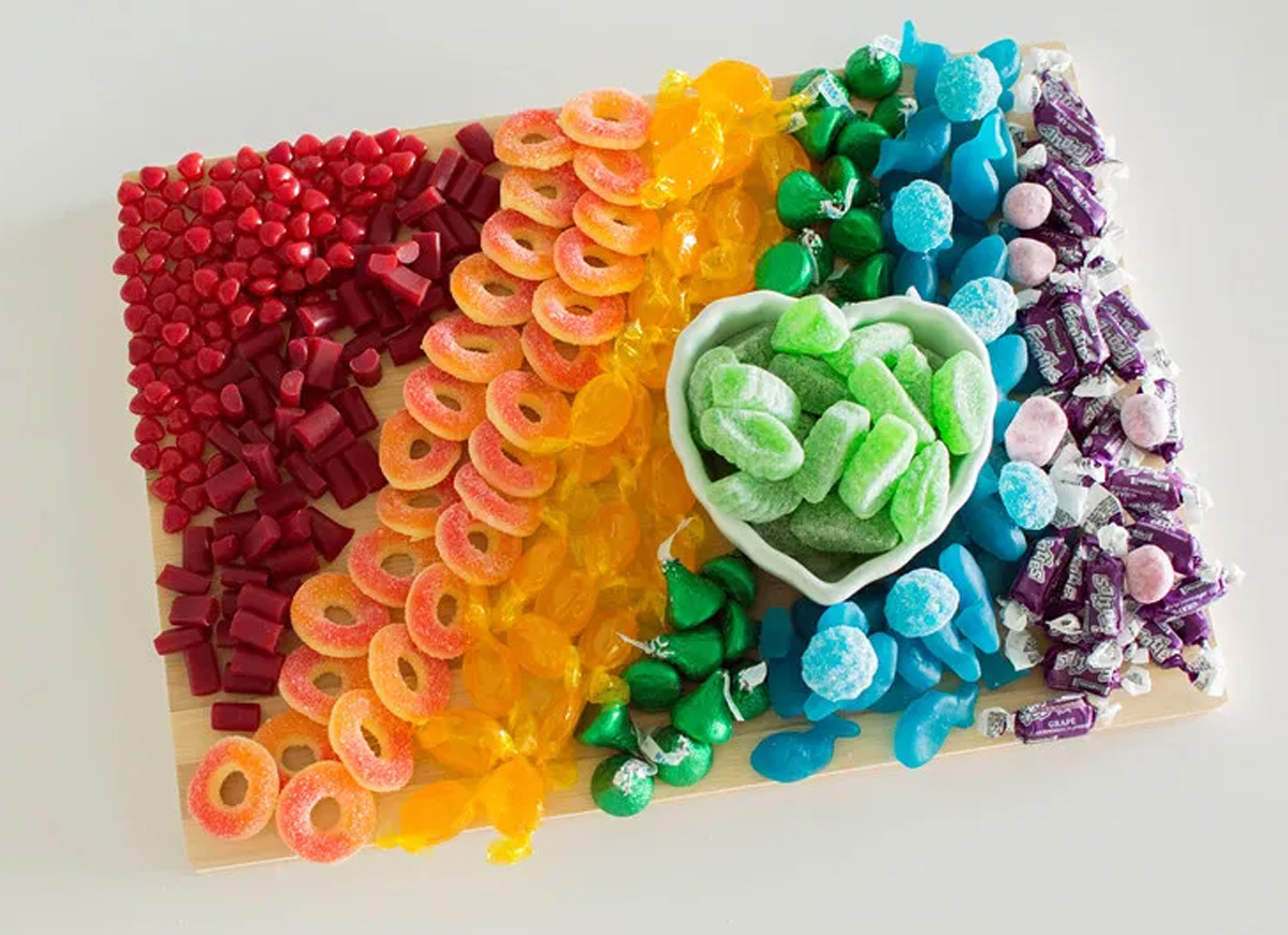 a rainbow of candy like peach rings, lemon drops, green Hersey kisses and more from tamara camera blog.