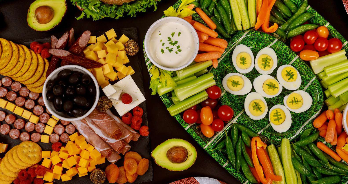 Eggs, tomatoes, peppers, meat, cheese, olives, and carrots fill Meal Garden's charcuterie board.