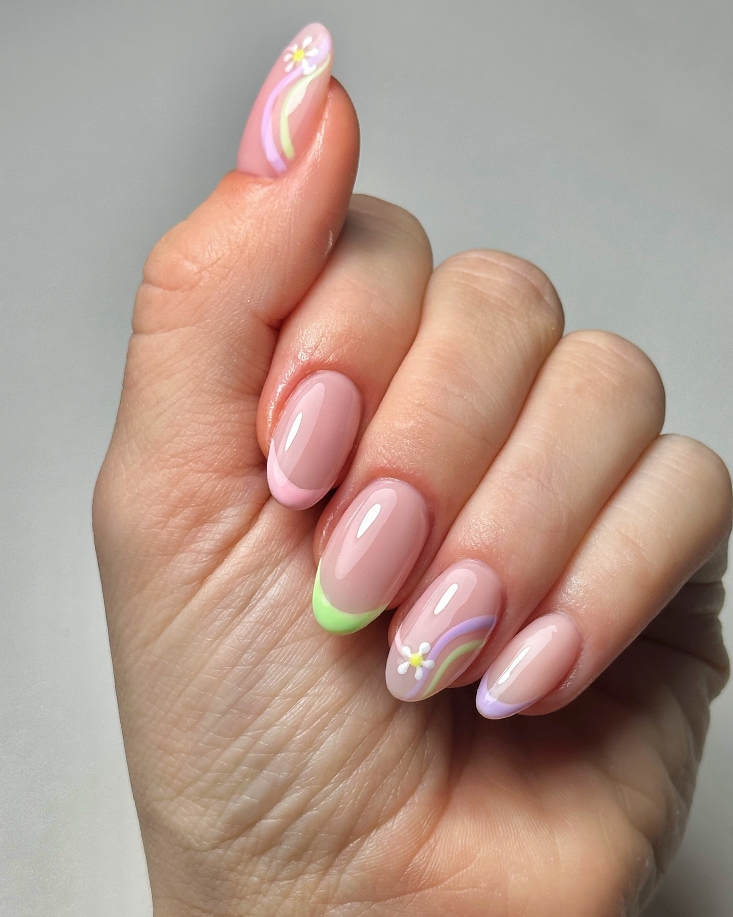 Spring french tip nails with a mix of pink and blue french tip nails, embodying spring nail designs and colorful nails for the season.