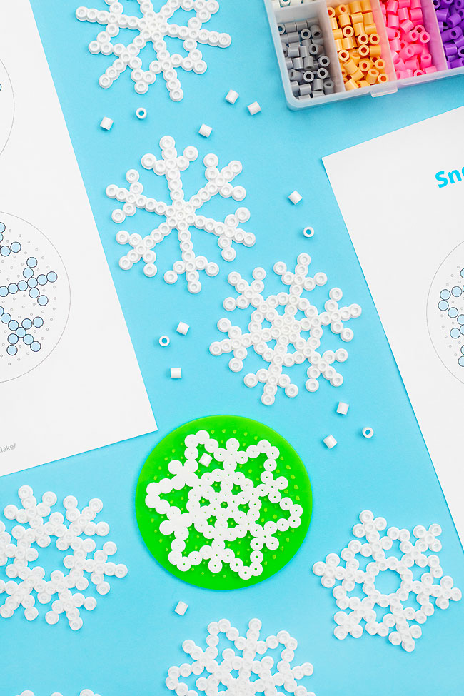 Snowflake patterns made from white Perler beads